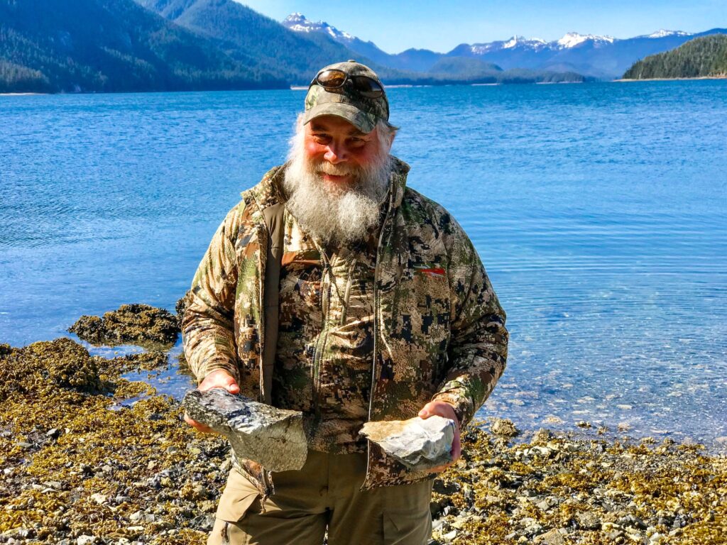 Geologist Jim Baichtal holding some fossils.