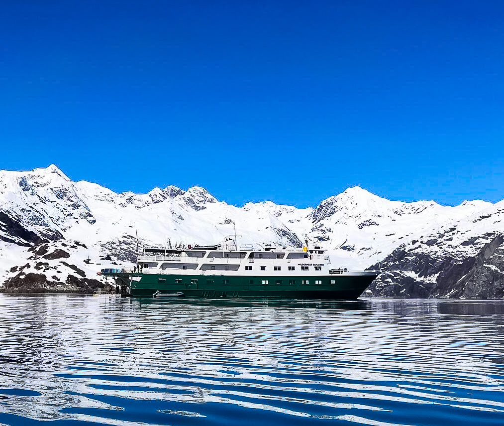 The UnCruise boat near some glaciers in Alaska.